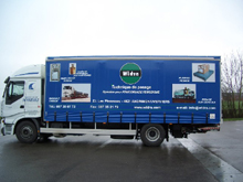 Rideaux de camion avec lettrage peinture et impression full quadri.